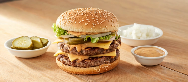 Which classic burger features two beef patties, special sauce, lettuce, cheese, pickles, and onions on a sesame seed bun?