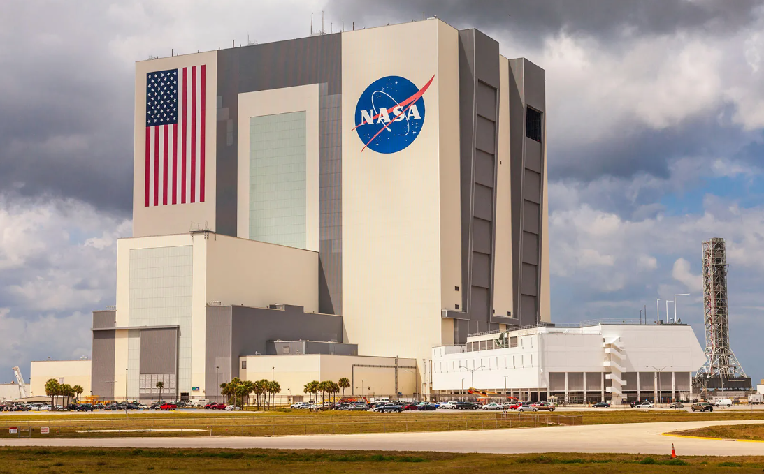 Which famous NASA launch site serves up cosmic history right next door to Merritt Island and Cocoa Beach?