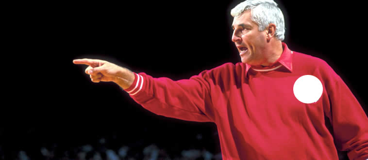 Which college basketball program tasted ultimate glory under the fierce leadership of Bobby Knight?