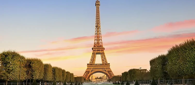 If you wanted to pair a view of the iconic Eiffel Tower with a fresh baguette, which country would you visit?