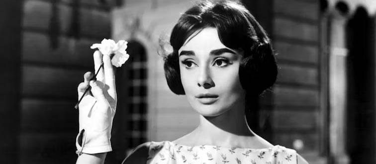 Can you name the iconic Hollywood screen icon captured in this snapshot?