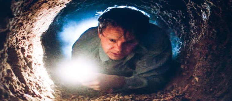 For our first course, identify the story where a man spends years carving a hole with a tiny rock hammer just to escape via a highly unsanitary sewer pipe.
