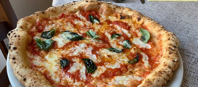 Take a bite out of this classic: which culinary-rich nation first served up the legendary pizza?